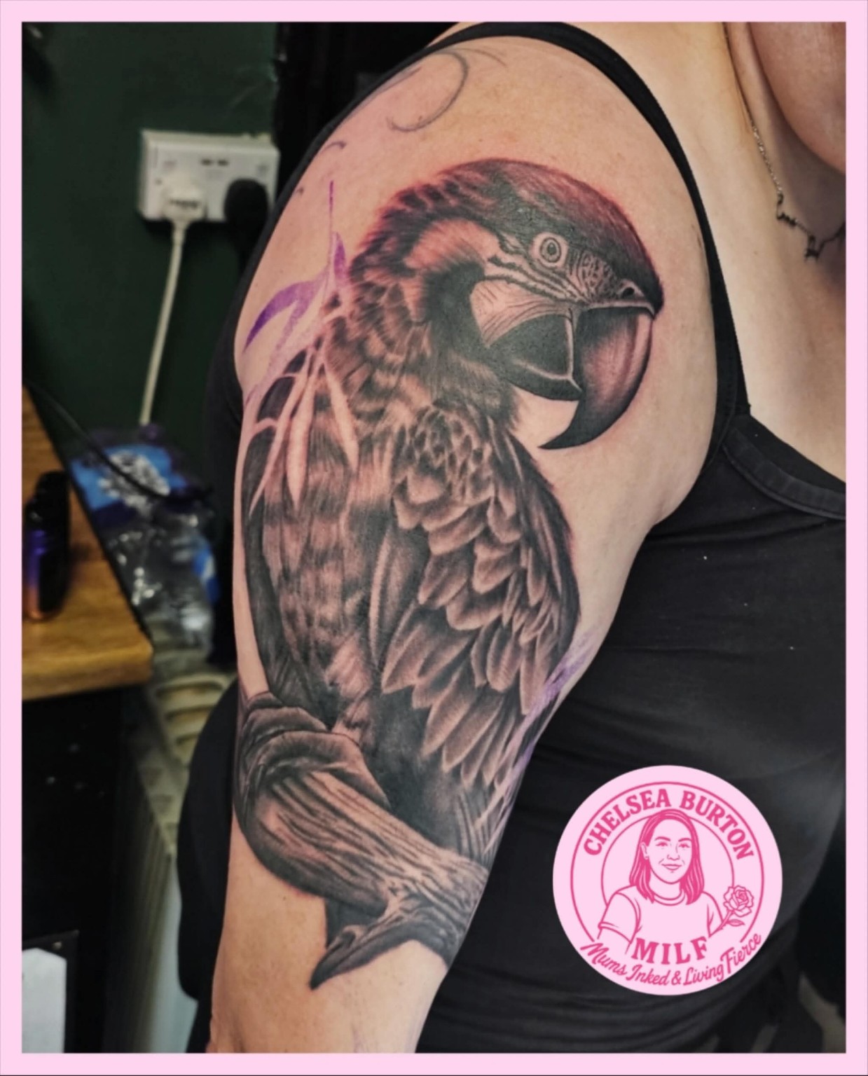 Black and grey realistic parrot tattoo